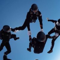 experienced fun jumpers skydive in formation