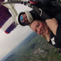 woman smiles tandem skydiving in Western Oregon
