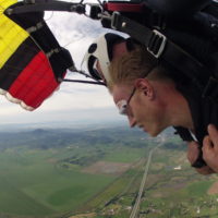 man enjoys the views of Oregon under skydiving canopy