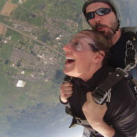 woman experiences the exhilaration of skydiving freefall